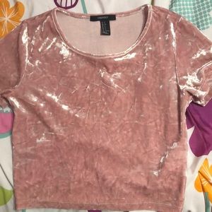 A pink velvet crop top